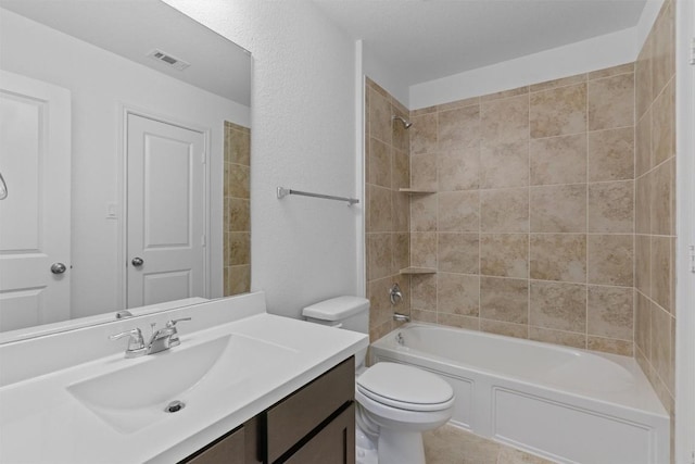 bathroom featuring toilet, visible vents, tub / shower combination, and vanity