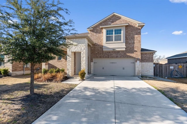 view of front of house featuring an attached garage, brick siding, fence, stone siding, and driveway