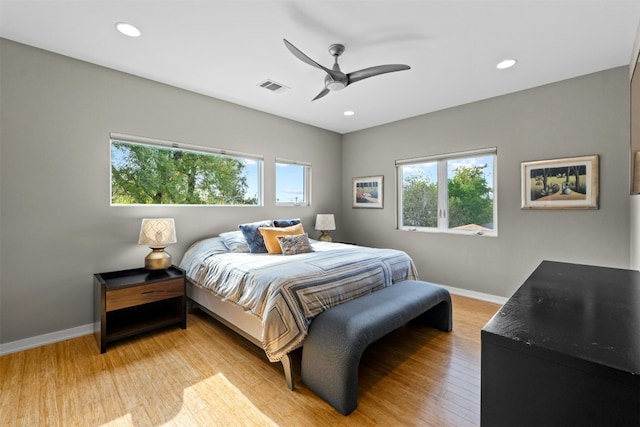 bedroom with light wood finished floors, recessed lighting, visible vents, ceiling fan, and baseboards