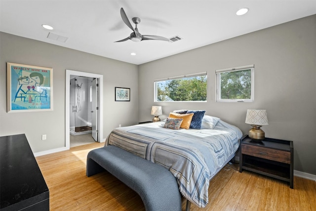 bedroom featuring recessed lighting, wood finished floors, visible vents, and baseboards