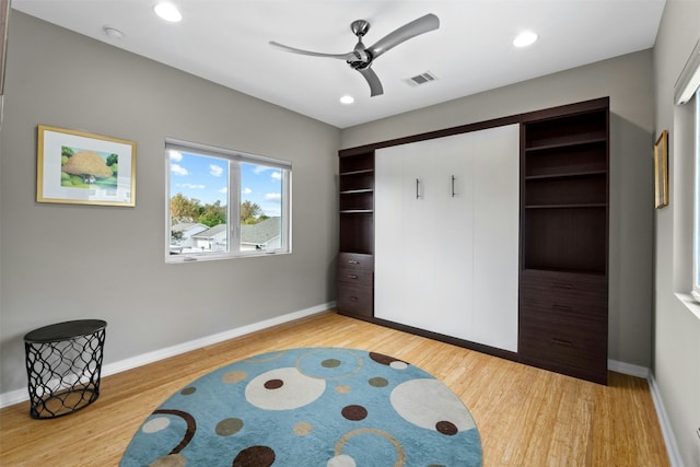 bedroom with recessed lighting, light wood-type flooring, visible vents, and baseboards