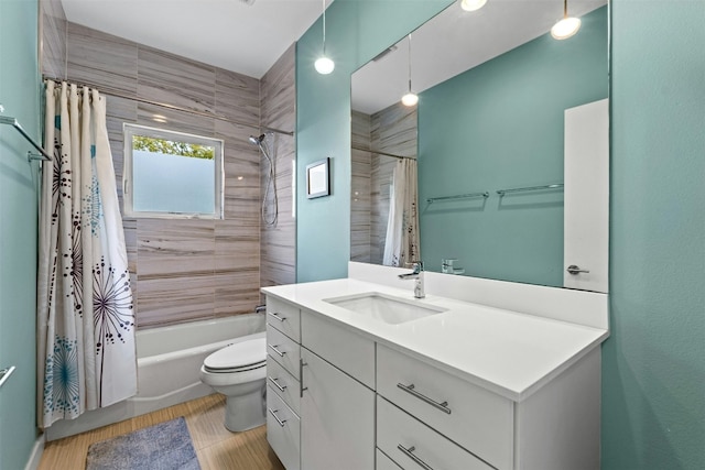 full bathroom featuring vanity, toilet, and shower / tub combo with curtain