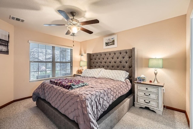 bedroom with baseboards, visible vents, ceiling fan, and light colored carpet