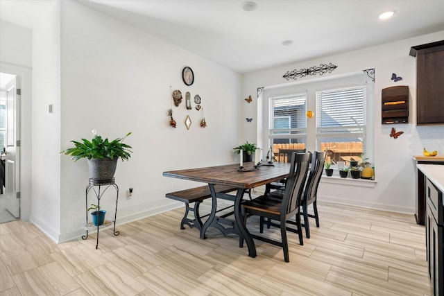 dining room featuring recessed lighting and baseboards