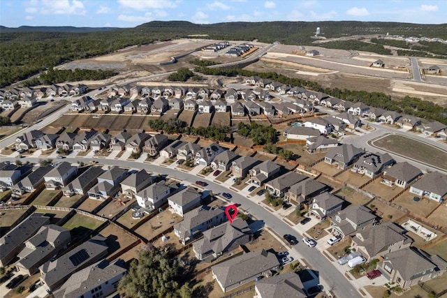 drone / aerial view featuring a residential view and a mountain view