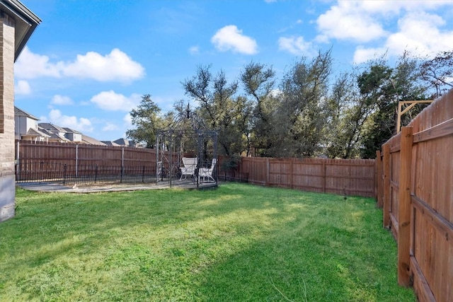 view of yard featuring a fenced backyard