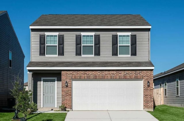 view of front facade with a garage, brick siding, and driveway