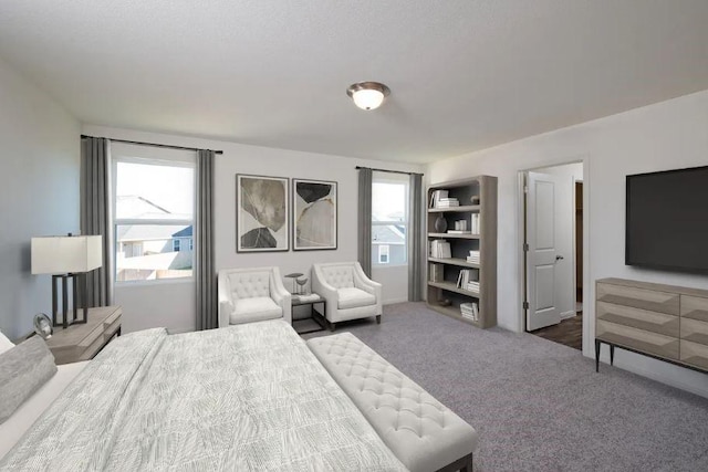 bedroom featuring dark colored carpet and multiple windows