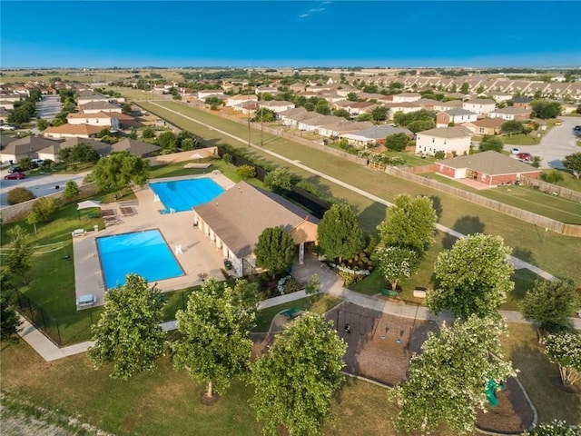 birds eye view of property with a residential view