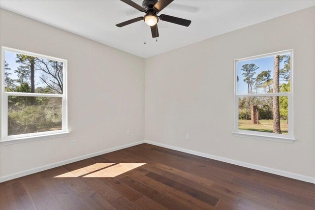 138 Pines Park Dr, Smithville, TX 78957 - empty room with baseboards, a healthy amount of sunlight, and hardwood / wood-style flooring