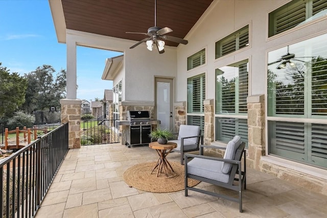 view of patio / terrace with ceiling fan, area for grilling, and a balcony