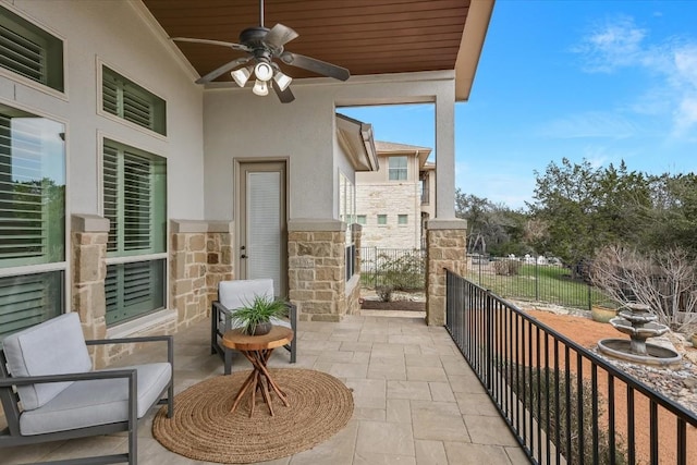 balcony featuring a patio and a ceiling fan