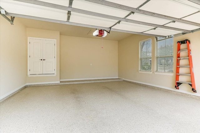 garage featuring baseboards and a garage door opener