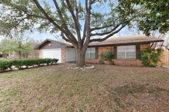 ranch-style home with brick siding and an attached garage