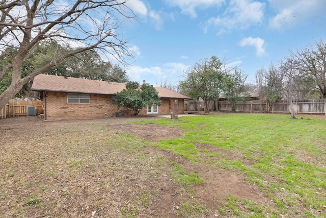 view of yard with a fenced backyard and cooling unit