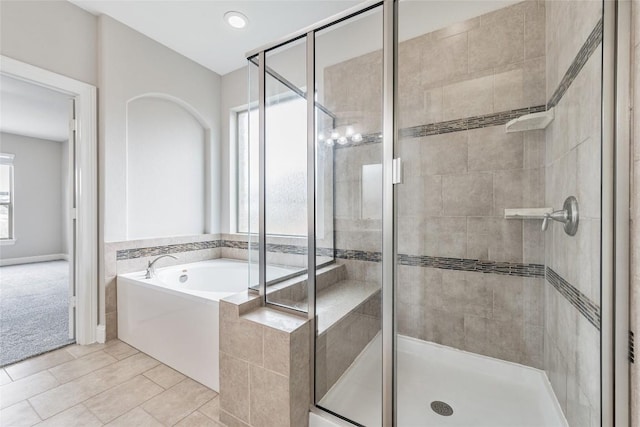 201 Seminole Canyon Dr, Georgetown, TX 78628 - full bath featuring a shower stall, a bath, and tile patterned flooring