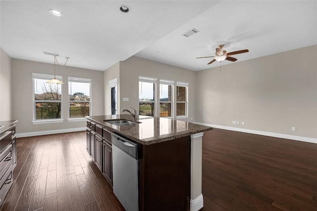 201 Seminole Canyon Dr, Georgetown, TX 78628 - kitchen with stainless steel dishwasher, a ceiling fan, dark wood-style flooring, open floor plan, and recessed lighting