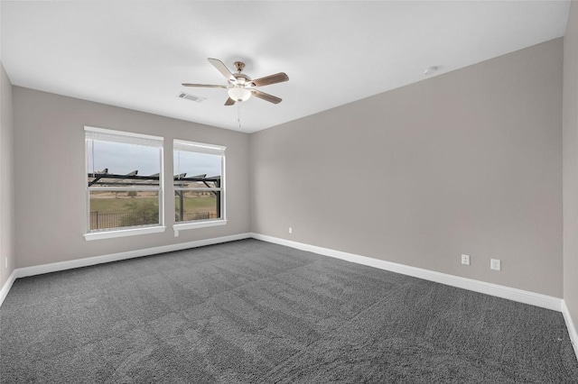 201 Seminole Canyon Dr, Georgetown, TX 78628 - spare room featuring a ceiling fan and dark colored carpet