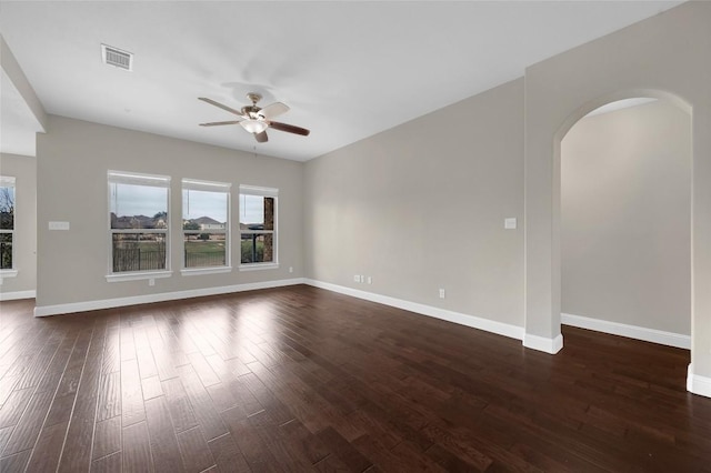 201 Seminole Canyon Dr, Georgetown, TX 78628 - spare room with ceiling fan, arched walkways, and dark wood-style floors