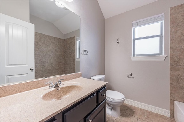 bathroom with lofted ceiling, tile patterned flooring, toilet, vanity, and baseboards