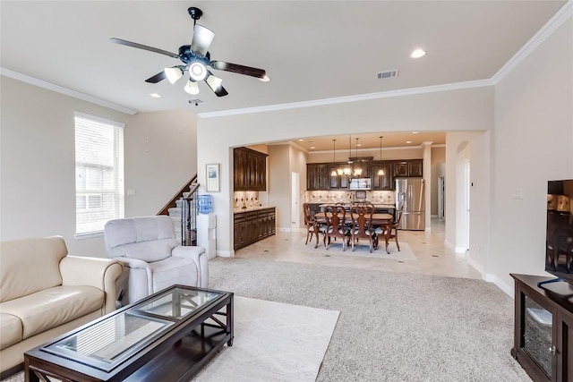 living area featuring recessed lighting, light carpet, visible vents, stairs, and crown molding