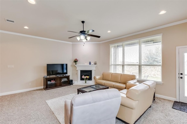 living area featuring light carpet, baseboards, visible vents, and crown molding