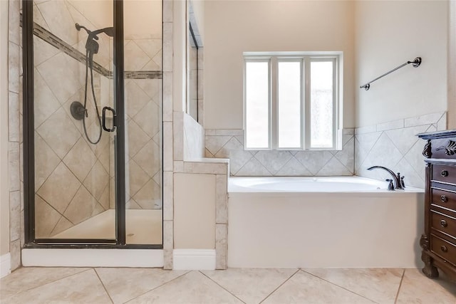1312 Mustang Brook Ln, Leander, TX 78641 - bathroom with tile patterned flooring, a garden tub, a shower stall, and vanity