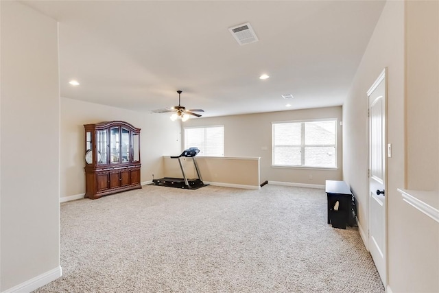 workout room featuring light carpet, baseboards, visible vents, a ceiling fan, and recessed lighting