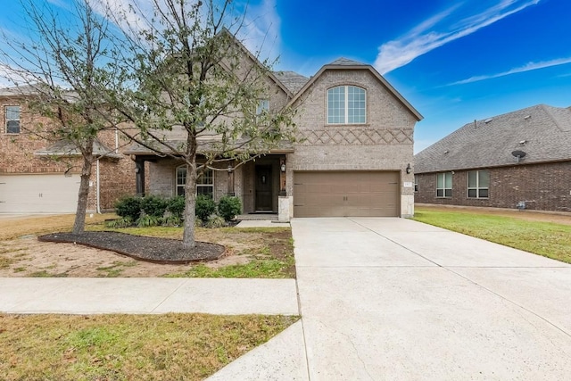 1312 Mustang Brook Ln, Leander, TX 78641 - traditional-style house featuring a garage, brick siding, concrete driveway, and a front yard