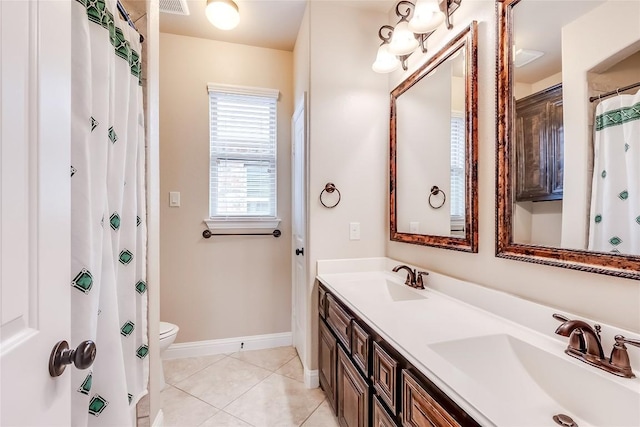 full bathroom with tile patterned flooring, a sink, baseboards, and double vanity