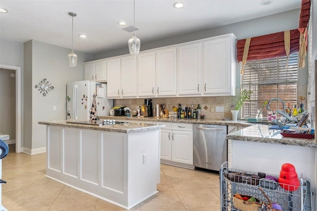 kitchen with a kitchen island, white cabinetry, hanging light fixtures, light stone countertops, and dishwasher