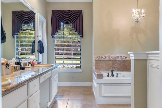 bathroom featuring double vanity, baseboards, a garden tub, a notable chandelier, and a sink