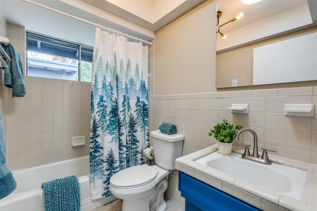 400 Cherry Hill Dr, Austin, TX 78704 - full bathroom with toilet, a wainscoted wall, tile walls, shower / bathtub combination with curtain, and vanity