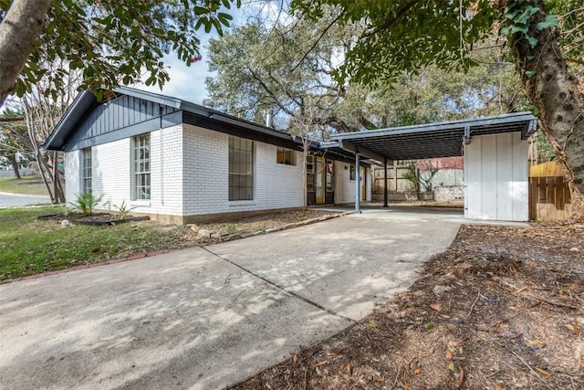 400 Cherry Hill Dr, Austin, TX 78704 - view of front of home featuring brick siding, driveway, and a carport