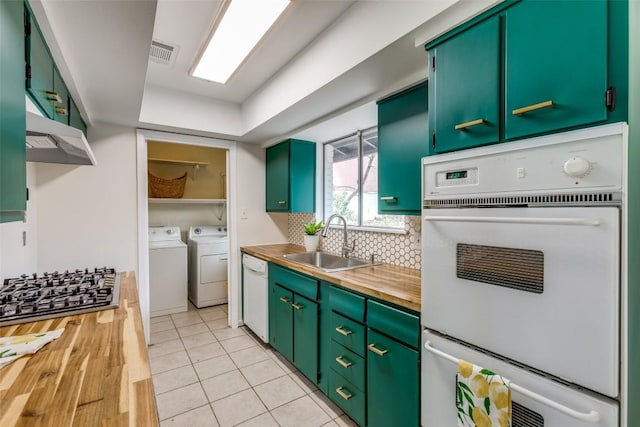 400 Cherry Hill Dr, Austin, TX 78704 - kitchen with a sink, separate washer and dryer, wood counters, visible vents, and white appliances