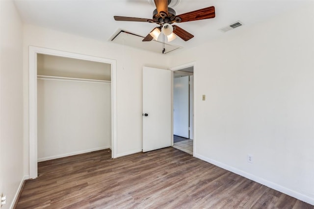 400 Cherry Hill Dr, Austin, TX 78704 - unfurnished bedroom with attic access, a closet, baseboards, and wood finished floors
