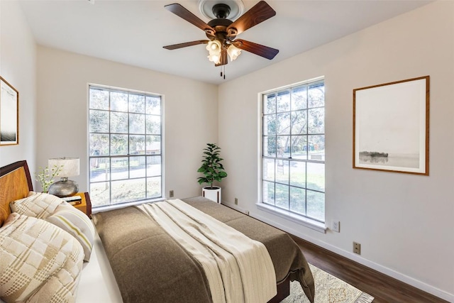 400 Cherry Hill Dr, Austin, TX 78704 - bedroom featuring baseboards, a ceiling fan, and dark wood finished floors