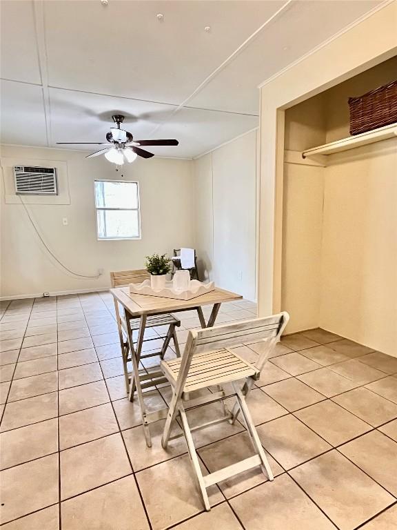 400 Cherry Hill Dr, Austin, TX 78704 - dining space featuring light tile patterned floors, ceiling fan, and a wall unit AC