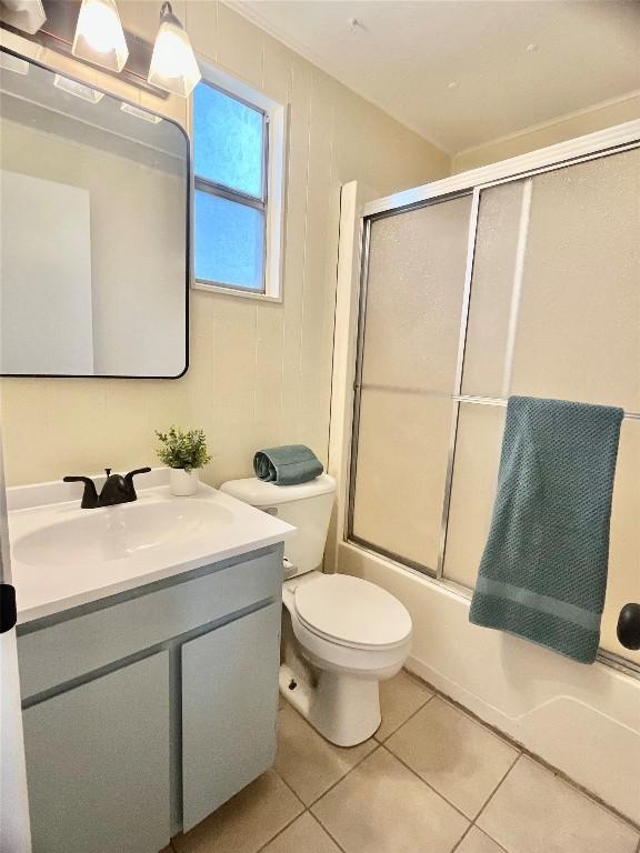 400 Cherry Hill Dr, Austin, TX 78704 - bathroom with toilet, enclosed tub / shower combo, tile patterned flooring, and vanity