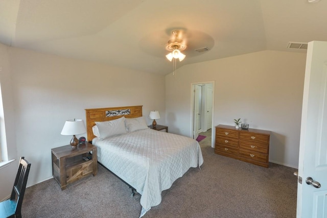 bedroom with visible vents, vaulted ceiling, and carpet flooring