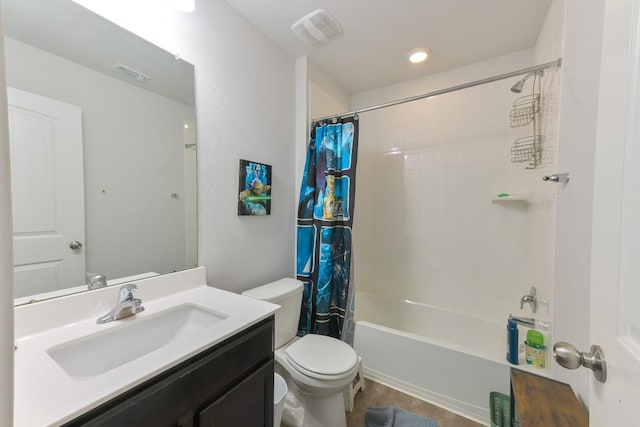 bathroom featuring toilet, shower / bath combo, vanity, and visible vents