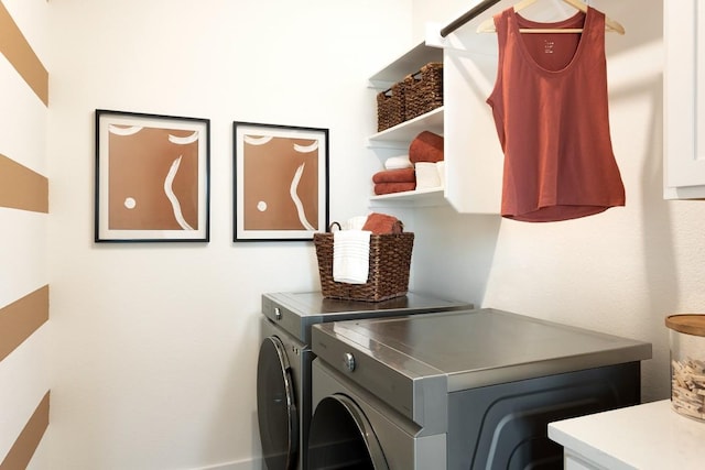 washroom with laundry area and independent washer and dryer