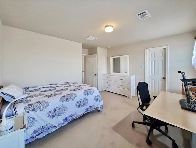 bedroom featuring light carpet and visible vents