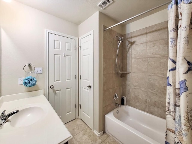 full bathroom with tile patterned floors, visible vents, vanity, and shower / bath combo with shower curtain