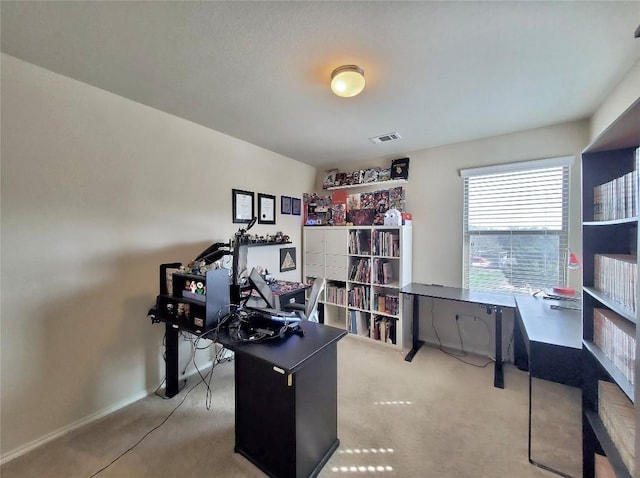 office space featuring light carpet and visible vents