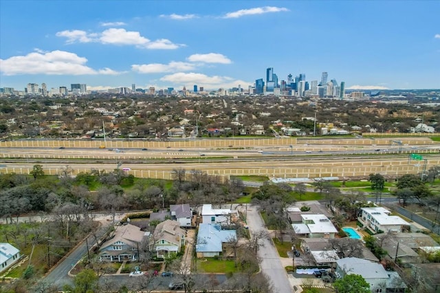 birds eye view of property with a city view