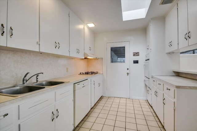 kitchen featuring light countertops, white cabinetry, and dishwasher