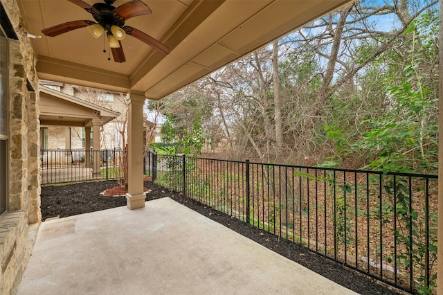 view of patio with a fenced backyard and a ceiling fan