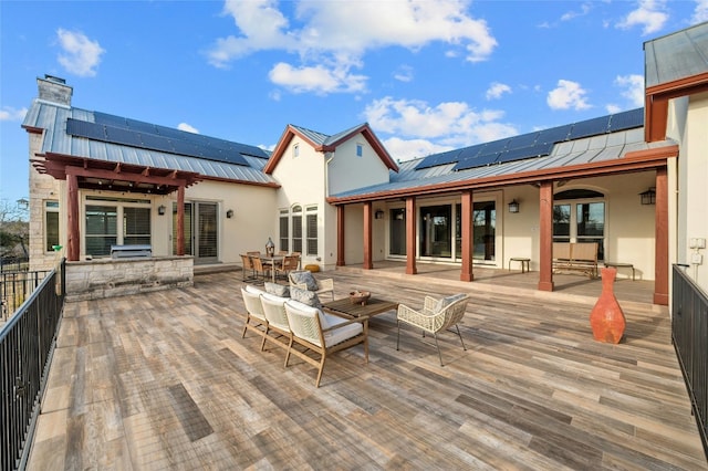 wooden terrace with outdoor dining space