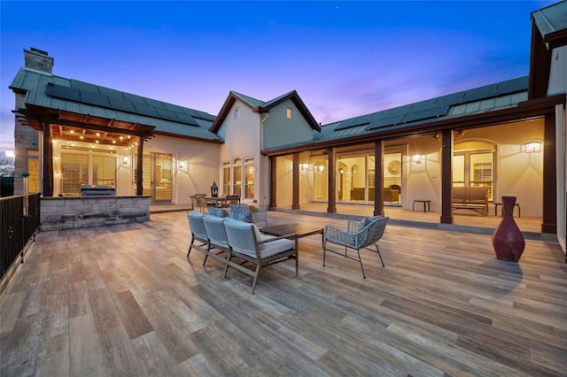 wooden terrace with outdoor dining space